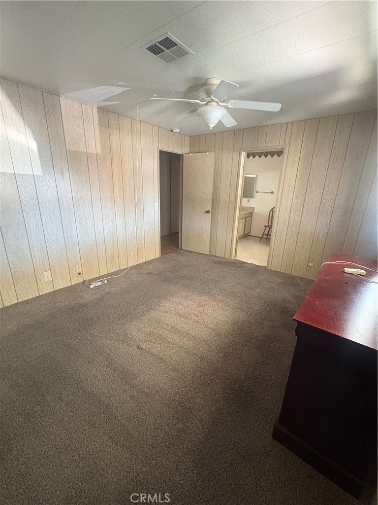 13393 Mariposa Road, Unit 114 Victorville, CA 92395 - Photo 12 of 18 a view of a room with a cabinet and mirrors