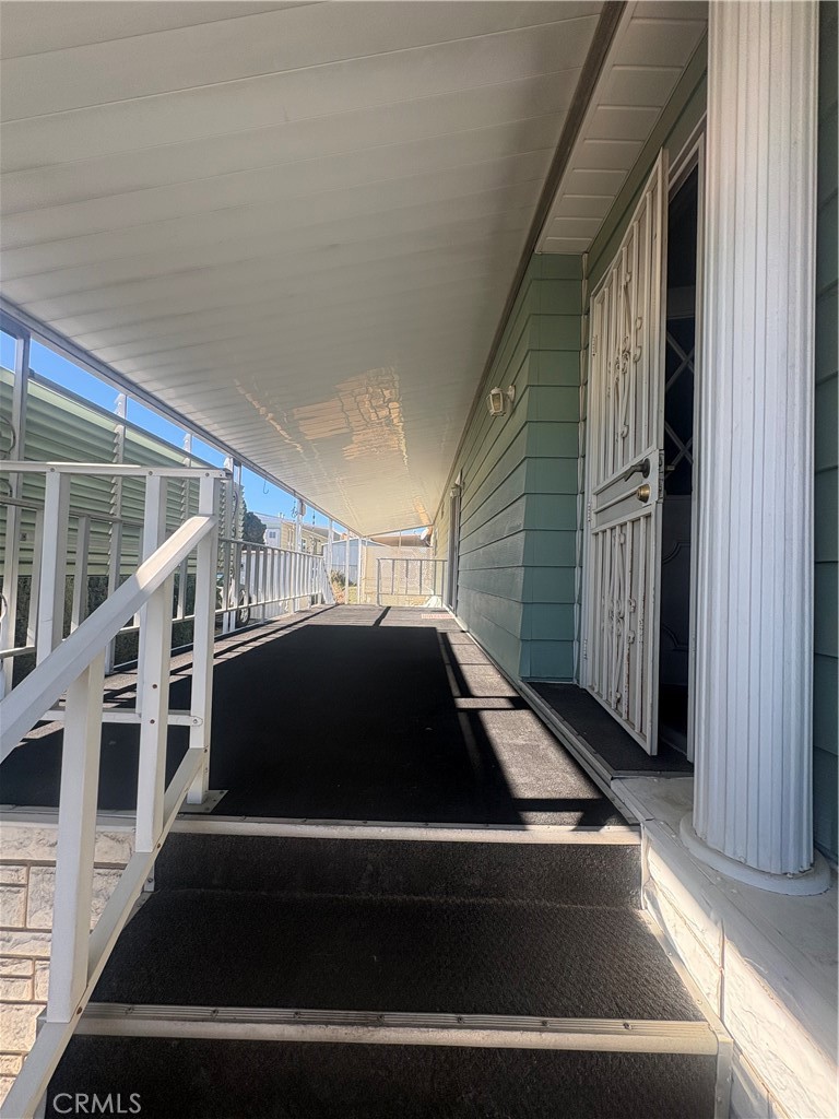 13393 Mariposa Road, Unit 114 Victorville, CA 92395 - Photo 16 of 18 a front view of a house with entryway