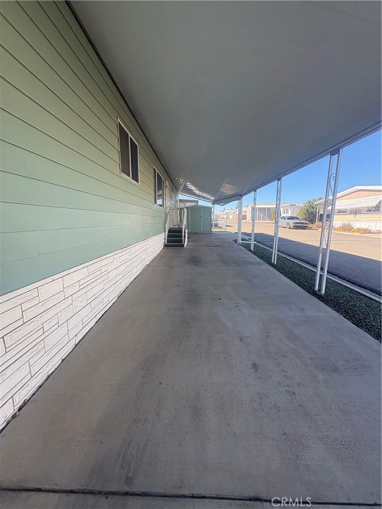 13393 Mariposa Road, Unit 114 Victorville, CA 92395 - Photo 17 of 18 a view of an empty room with a fireplace