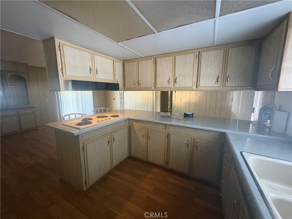 13393 Mariposa Road, Unit 114 Victorville, CA 92395 - Photo 5 of 18 a kitchen with sink cabinets and window
