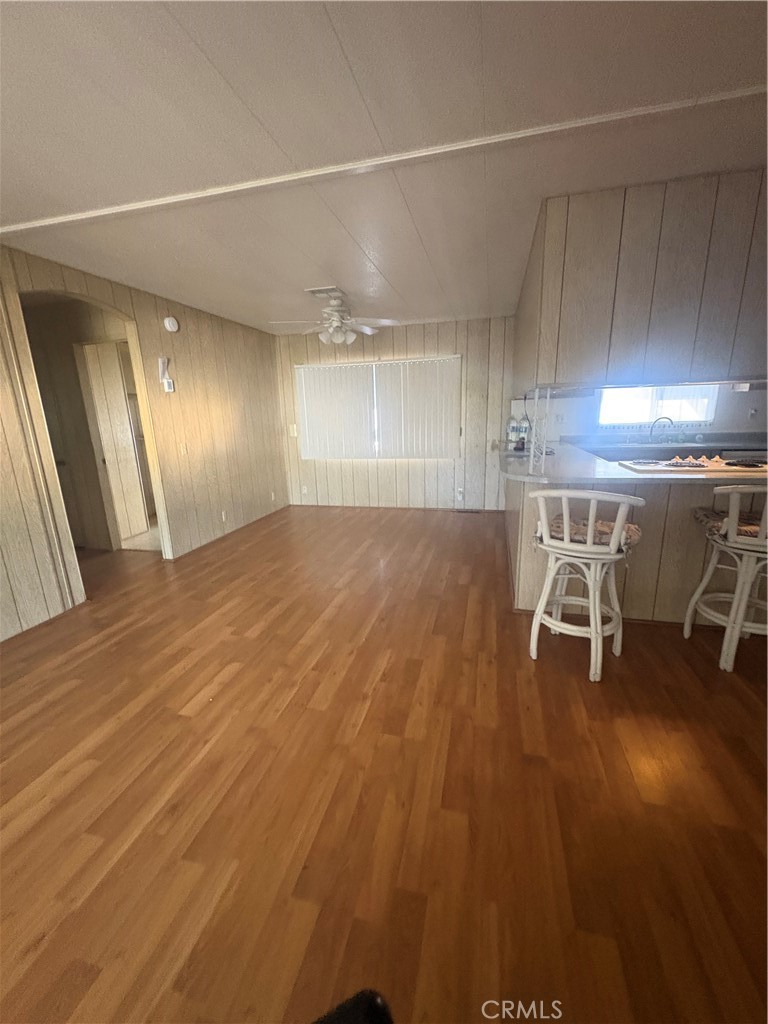 13393 Mariposa Road, Unit 114 Victorville, CA 92395 - Photo 7 of 18 a view of a room with wooden floor