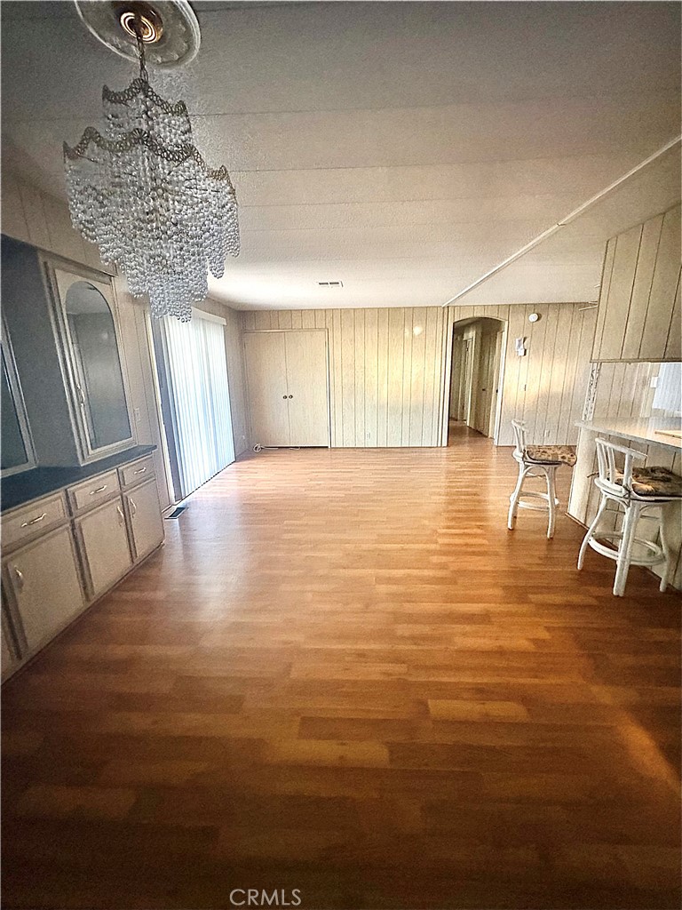 13393 Mariposa Road, Unit 114 Victorville, CA 92395 - Photo 10 of 18 a view of a livingroom with wooden floor
