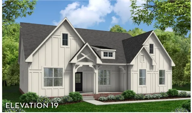 a view of white house with a yard