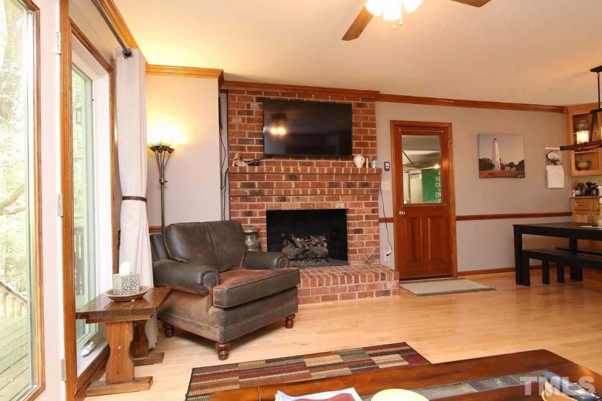 1720 Park Ridge Way Raleigh, NC 27614 - Photo 8 of 25 a living room with furniture and a fireplace
