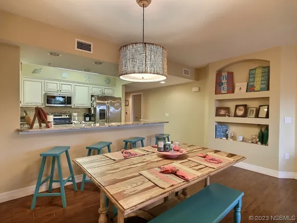 a view of a dining room with furniture
