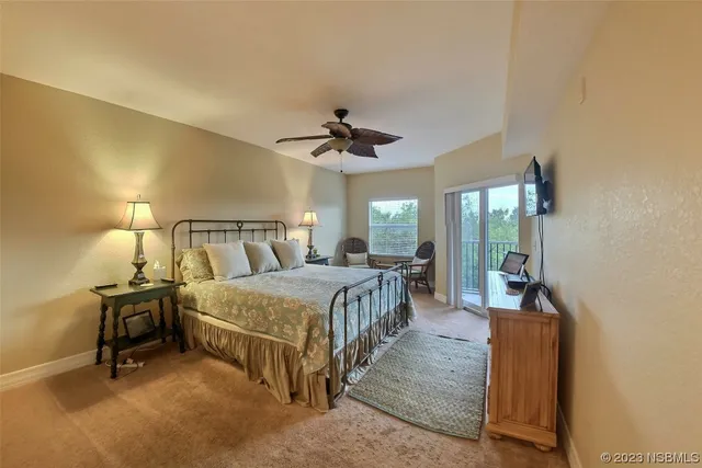 a bed room with a bed and a chandelier