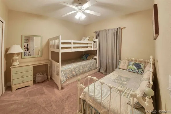 a bedroom with a bed and a cabinets