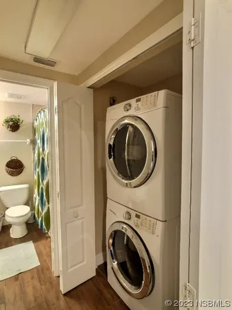 a view of a hallway with washer and dryer