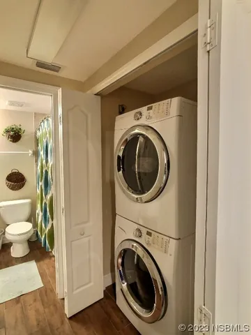 a view of a hallway with washer and dryer