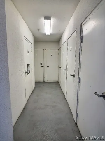 a view of a hallway with white walls