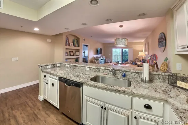 a kitchen with a sink and a stove