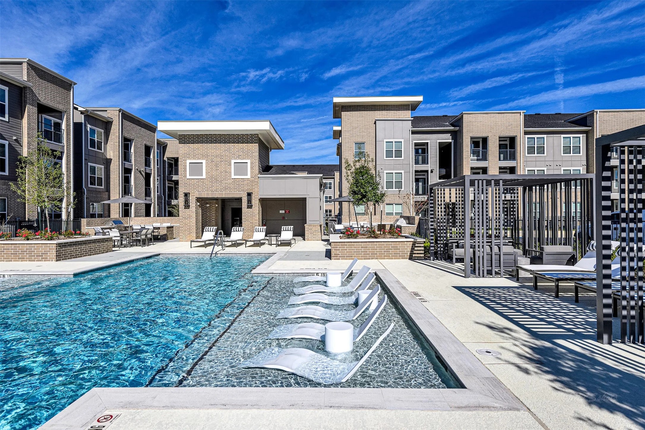 3830 Fm 2920 Rd Spring, Unit 5104 Spring, TX 77388 - Photo 19 of 32 a swimming pool with outdoor seating