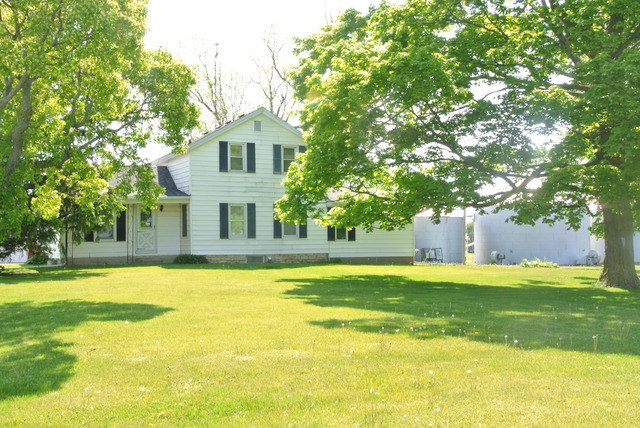6388 Leland Road Waterman, IL 60556 - Photo 2 of 23 a view of a house with a swimming pool