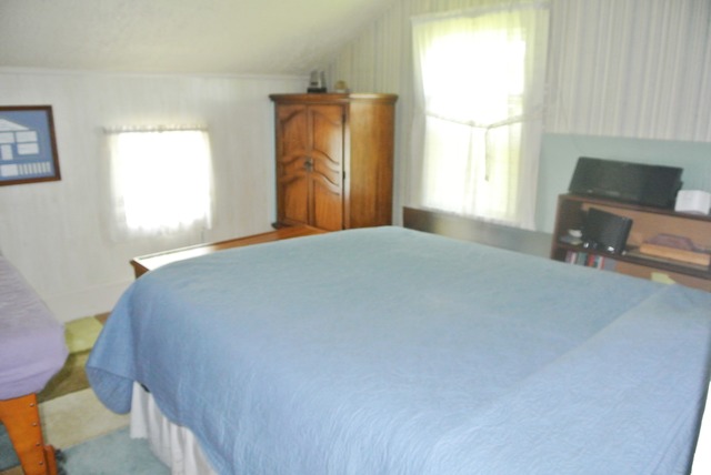 6388 Leland Road Waterman, IL 60556 - Photo 20 of 23 a bedroom with a bed and a window