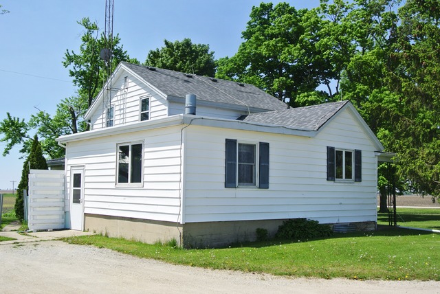 6388 Leland Road Waterman, IL 60556 - Photo 22 of 23 a view of a house with a yard