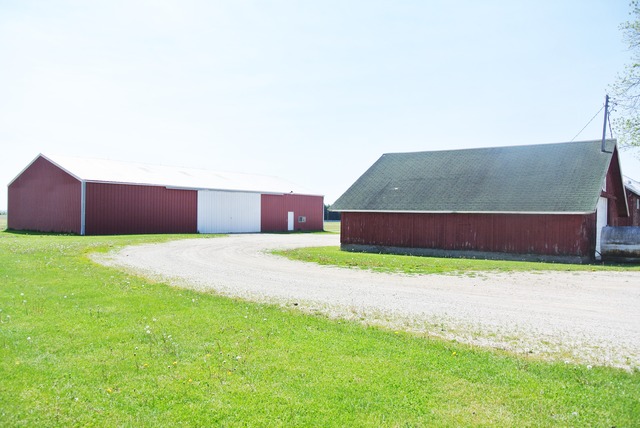 6388 Leland Road Waterman, IL 60556 - Photo 5 of 23 a building with trees in front of it