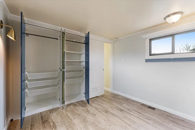 a view of an empty walk in closet