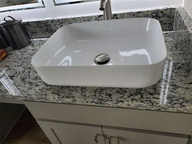 a view of a sink in a kitchen