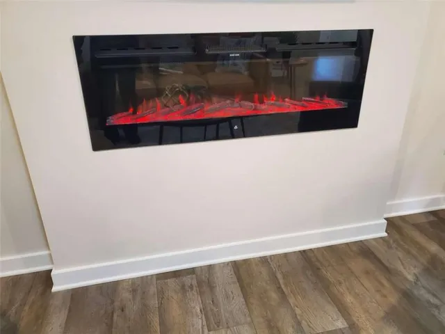 a utility room with wooden floor