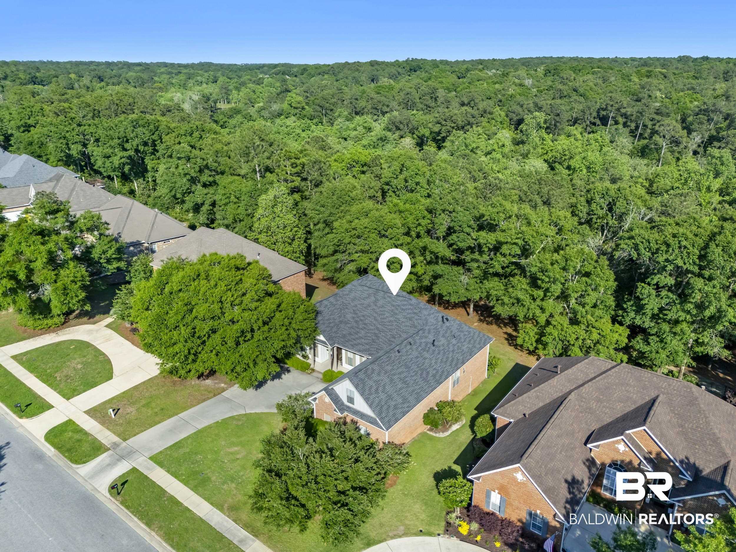 8137 Pine Run Daphne, AL 36527 - Photo 46 of 67 Aerial perspective showcasing a residential property with a dark shingle roof and brick exterior