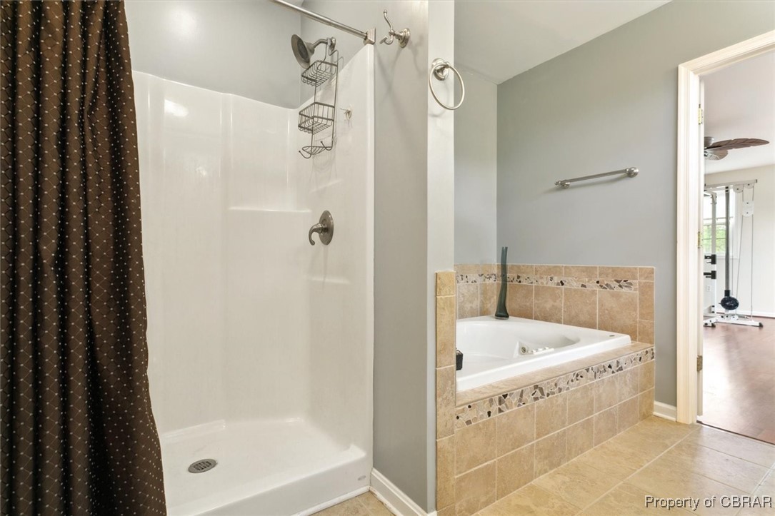 345 Fox Hill Road Hampton, VA 23669 - Photo 28 of 46 Bathroom with baseboards, tile patterned flooring, a ceiling fan, a shower stall, and a bath