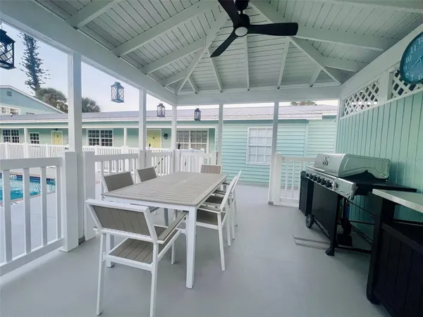 a outdoor dining space with furniture