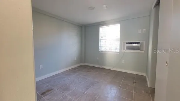 a view of an empty room with a window