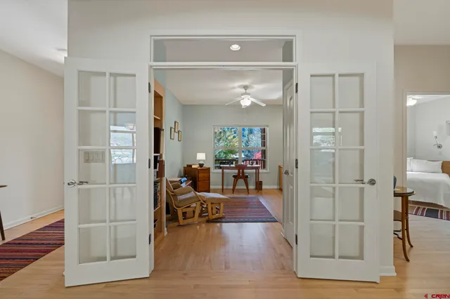 a view of a workspace with furniture and a potted plant