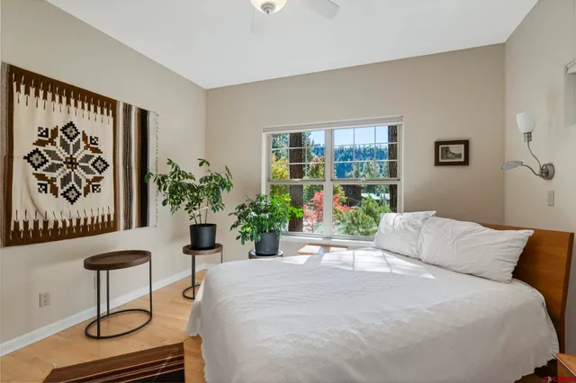 a bedroom with a bed and cabinets