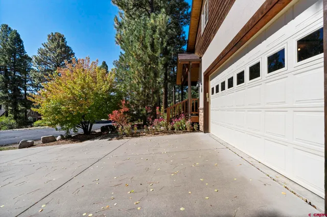 a view of a street with flower plants