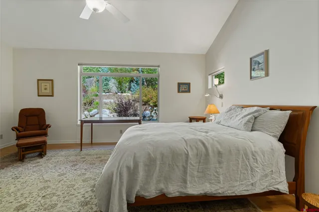 a bathroom with a tub shower and window