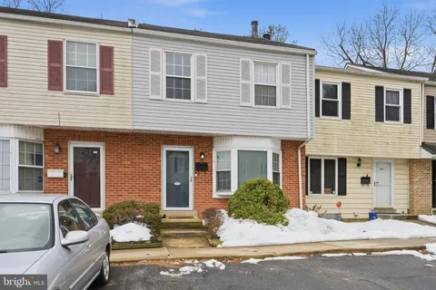 a front view of a house with outdoor seating