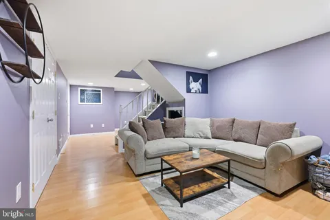 a living room with furniture and a rug