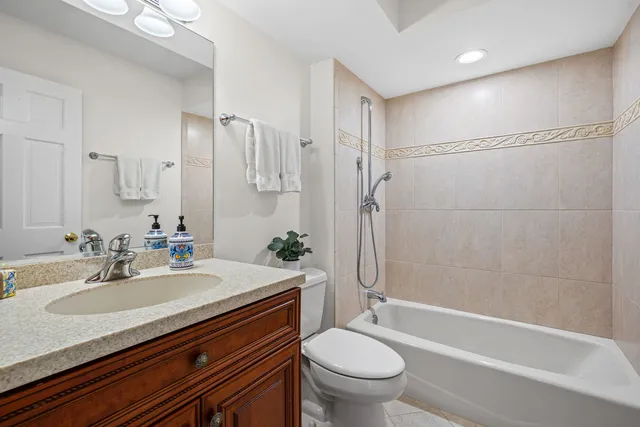 a bathroom with a sink a toilet and a bathtub