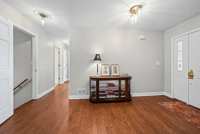 a view of room with wooden floor