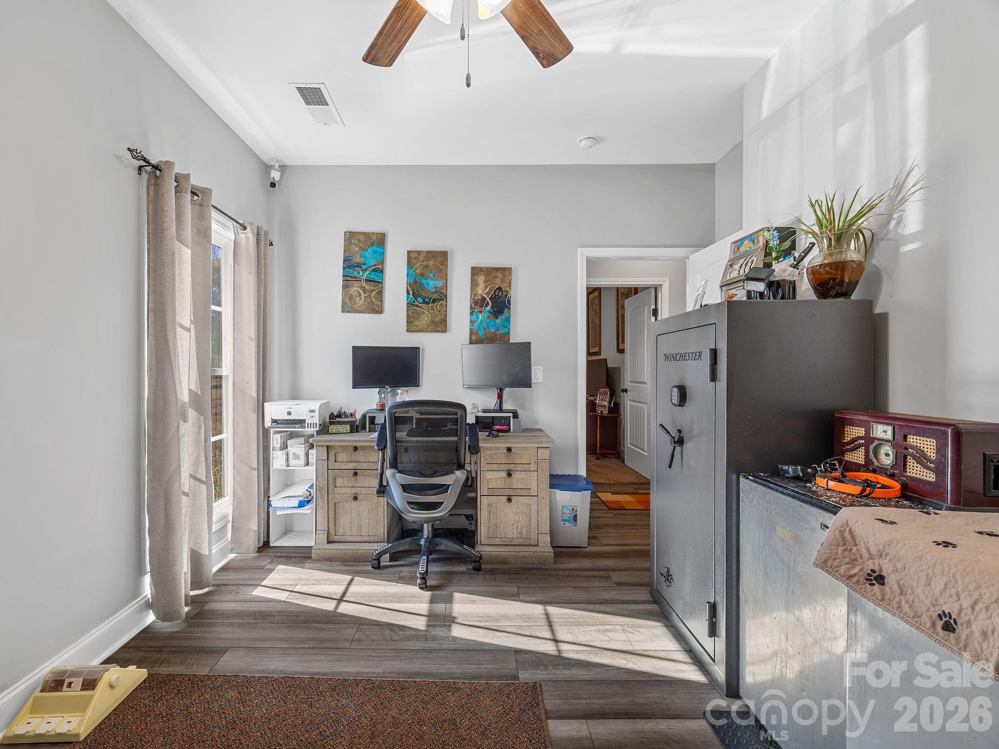 1076 McSwain Road Chesnee, SC 29323 - Photo 23 of 36 a view of a workspace with furniture and a window