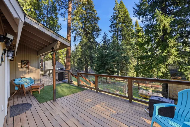 a view of a house with backyard porch and sitting area