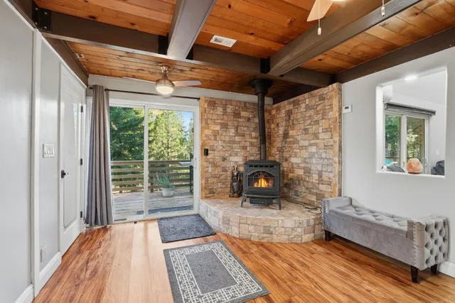 a large white kitchen with a sink and refrigerator
