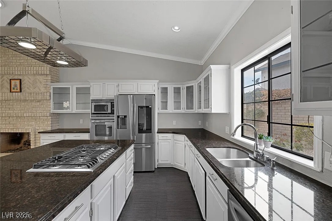 9 Quail Run Road Henderson, NV 89014 - Photo 22 of 57 Culinary creations come to life in this spacious kitchen, boasting premium appliances and ample counter space.