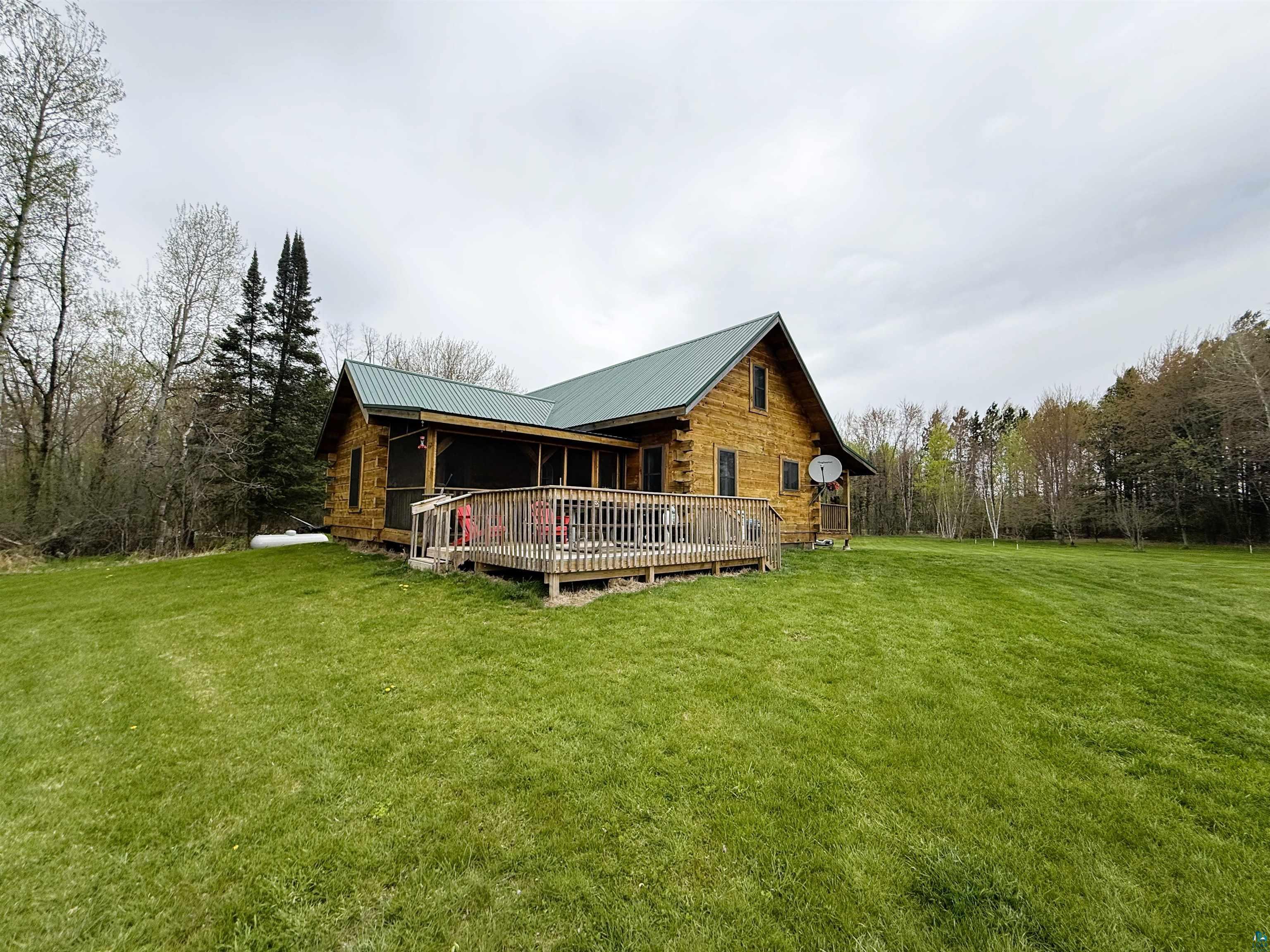 37590 Degerstrom Road Askov, MN 55704 - Photo 41 of 53 Log cabin exterior with a green metal roof