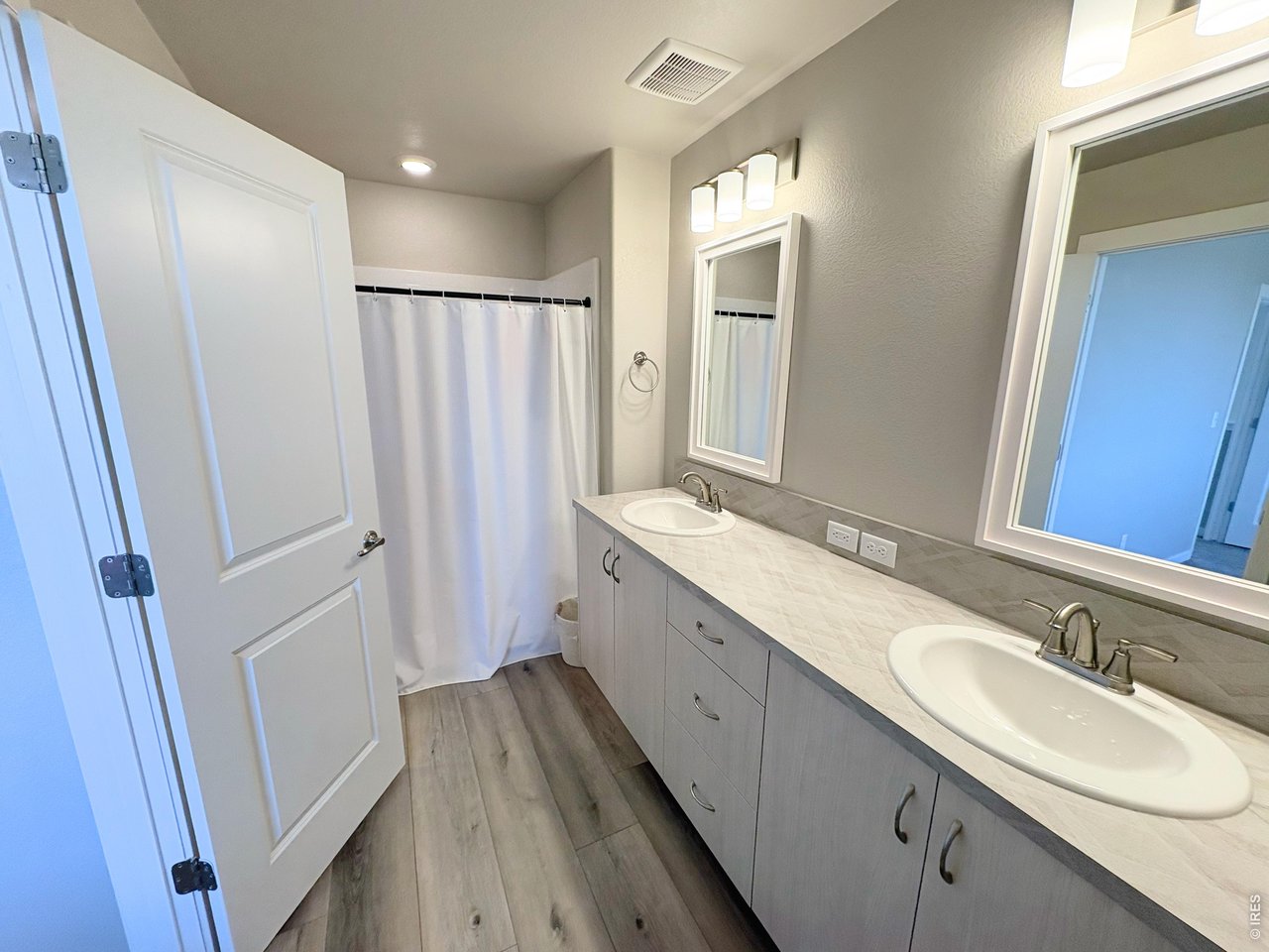 333 Pyramid Peak Street Berthoud, CO 80513 - Photo 11 of 21 a bathroom with a double vanity sink and mirror