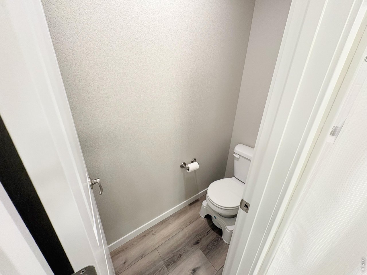 333 Pyramid Peak Street Berthoud, CO 80513 - Photo 12 of 21 a white toilet sitting in a bathroom next to a sink