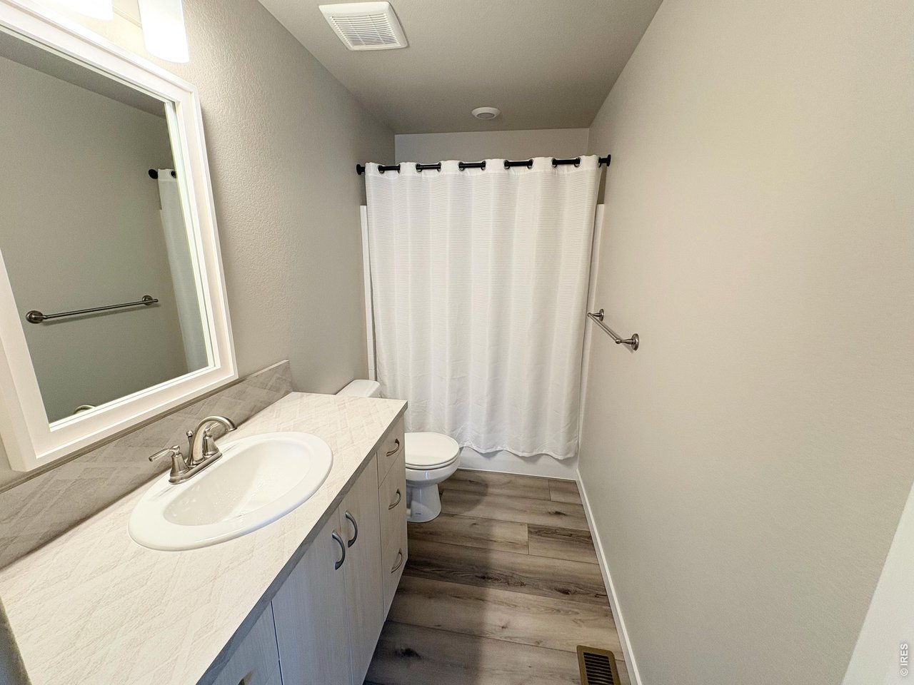 333 Pyramid Peak Street Berthoud, CO 80513 - Photo 14 of 21 a bathroom with a double vanity sink and a mirror