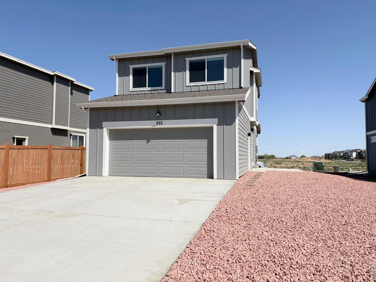 333 Pyramid Peak Street Berthoud, CO 80513 - Photo 3 of 21 a front view of a house with a yard