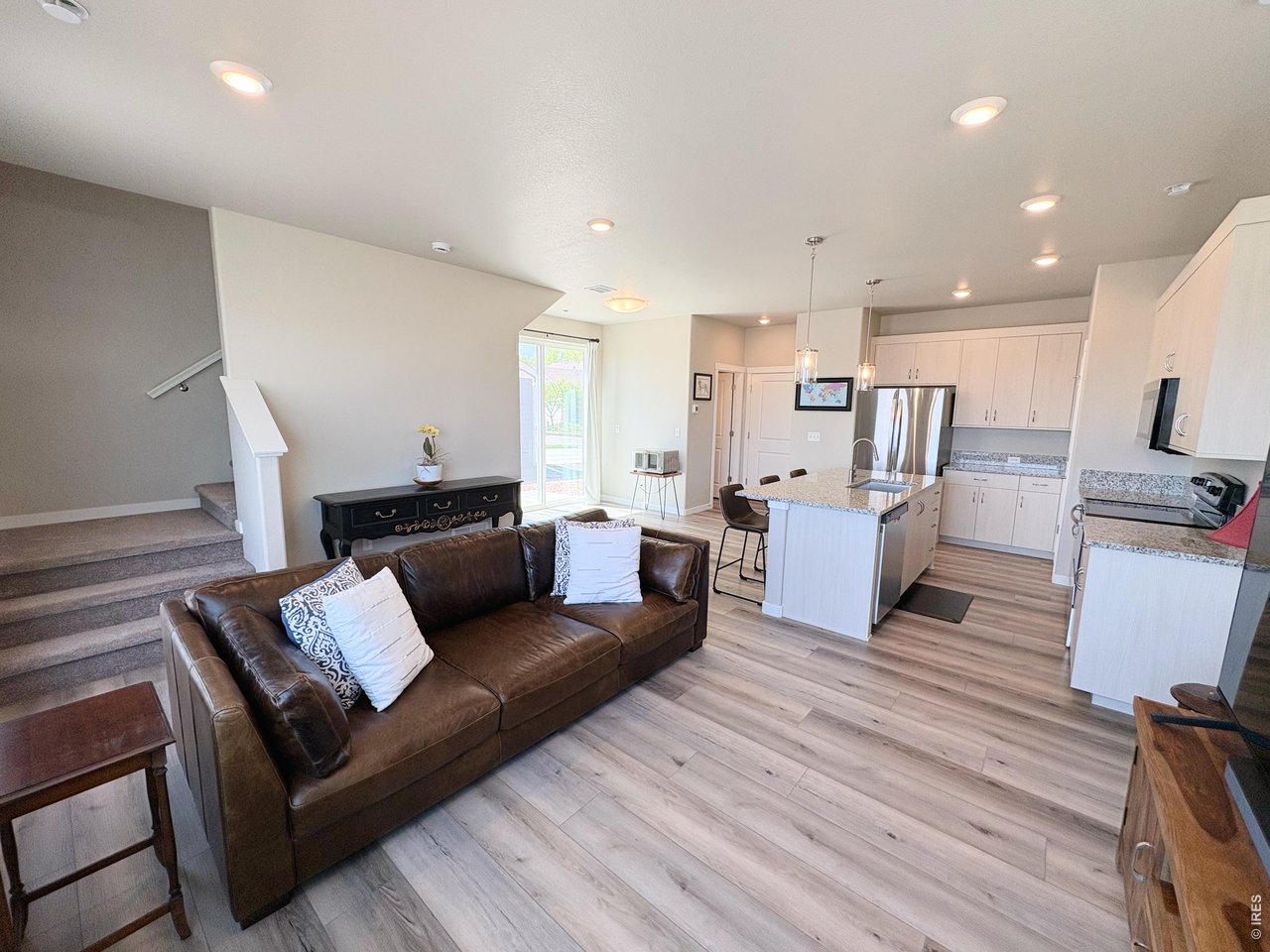333 Pyramid Peak Street Berthoud, CO 80513 - Photo 7 of 21 a living room with furniture and a wooden floor