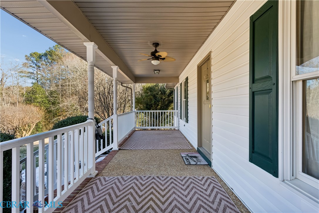6253 Ark Road Gloucester, VA 23061 - Photo 2 of 38 Covered porch featuring a ceiling fan