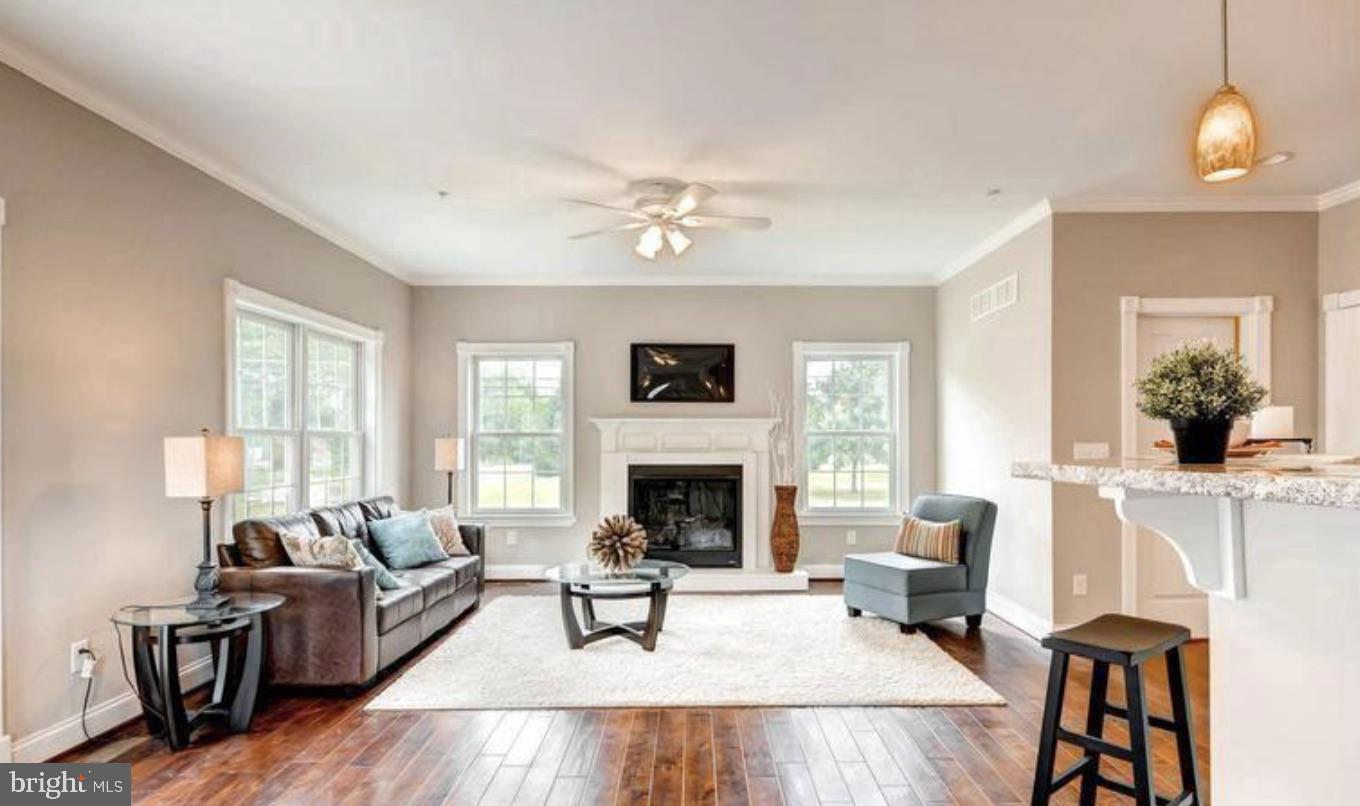 8319 Bletzer Road Baltimore, MD 21222 - Photo 3 of 7 a living room with furniture fireplace and window