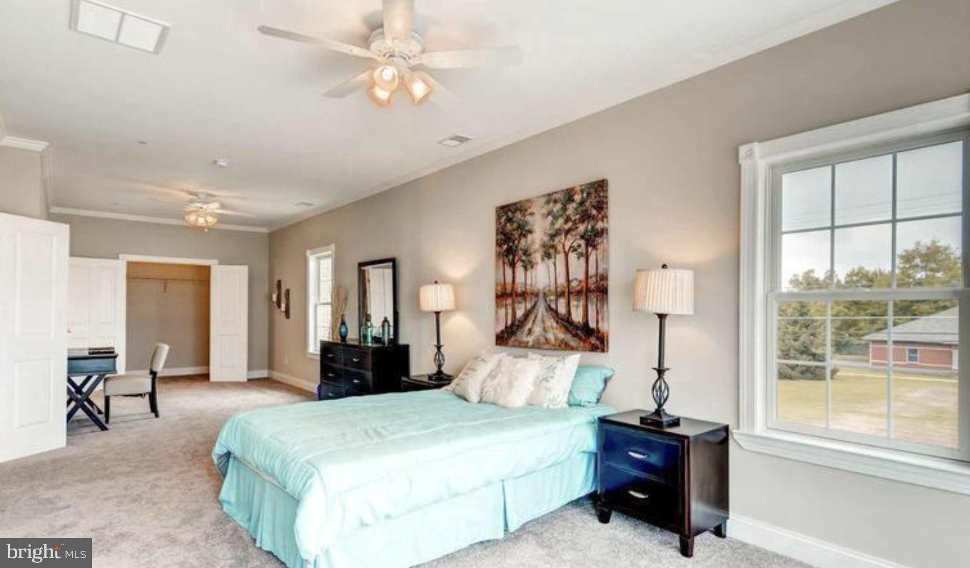 8319 Bletzer Road Baltimore, MD 21222 - Photo 6 of 7 a bedroom with a bed dresser and a large window