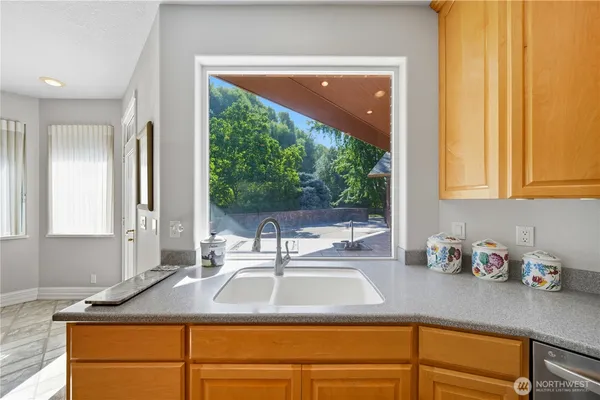 a kitchen with wooden floors and a stove