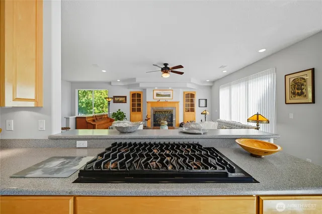 a kitchen with stainless steel appliances a sink and cabinets